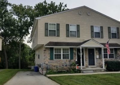 A house with a green door and white trim.