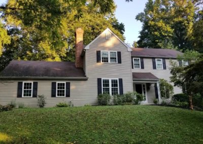 A house with black shutters and white trim.