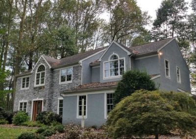 A large house with many windows and trees