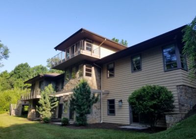 A large house with many windows and trees